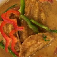 Catfish Curry · Lemongrass, red bell peppers, coconut milky curry leaves, basil, cilantro, lime leaf.