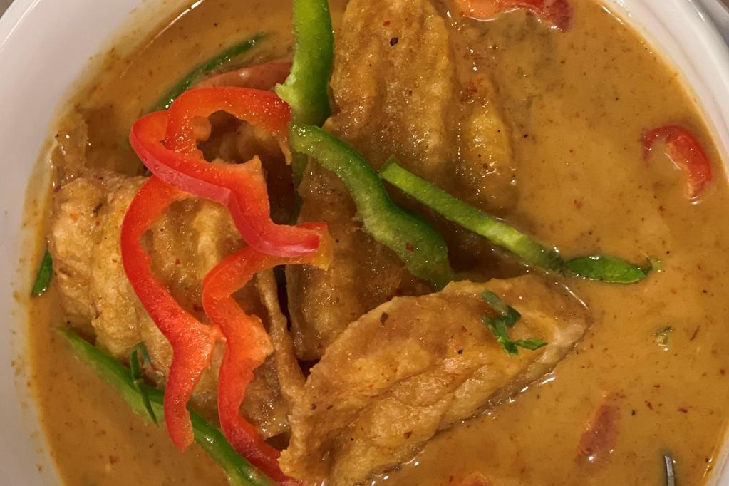 Catfish Curry · Lemongrass, red bell peppers, coconut milky curry leaves, basil, cilantro, lime leaf.