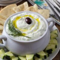 Tzatziki Appetizer · Homemade Greek dip with yogurt, garlic and cucumber. Served with Pita