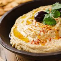 Hummus · Homemade chickpea spread blended with lemon, tahini and herbs. Served with pita.