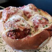 Mama's Italian Meatball Bread Bowl · 3 of our signature meatballs served in a garlic bread bowl that's been baked with cheese and...