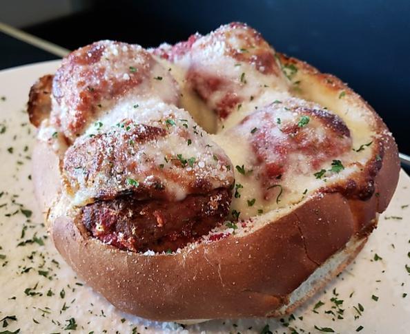 Mama's Italian Meatball Bread Bowl · 3 of our signature meatballs served in a garlic bread bowl that's been baked with cheese and our red sauce
