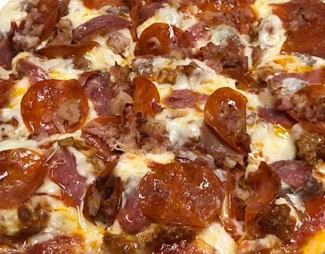 Carnivorous Cargo Pizza · Gluten free option available. A meat lover's dream. A pie piled high with pepperoni, our own sausage, fresh ground beef, salami, capicola and crumbled bacon. And, of course, lotsa mozza.
