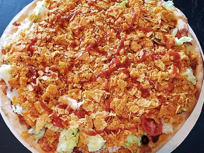 Taco Pizza · Gluten free option available. Taco sauce base, topped with Italian sausage, mozzarella, lettuce, tomato, red onion, black olives and taco chips.
