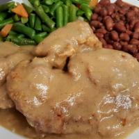 Smothered Pork Chops · Two Tender Center Cut Pork Chops Smothered in Our Famous Southern Gravy!