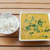 Daal Fry · Vegan. Gluten-free. Yellow lentils cooked, flavored with garlic and cilantro.