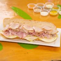 Cuban sandwich  · Seasoned pork and Boar's Head ham, your choice of Boar's Head cheese and your selection of v...