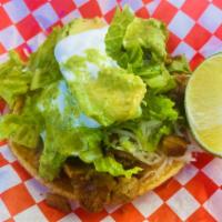 Super Taco · Choice of meat, cheese, lettuce, sour cream, avocado and salsa.