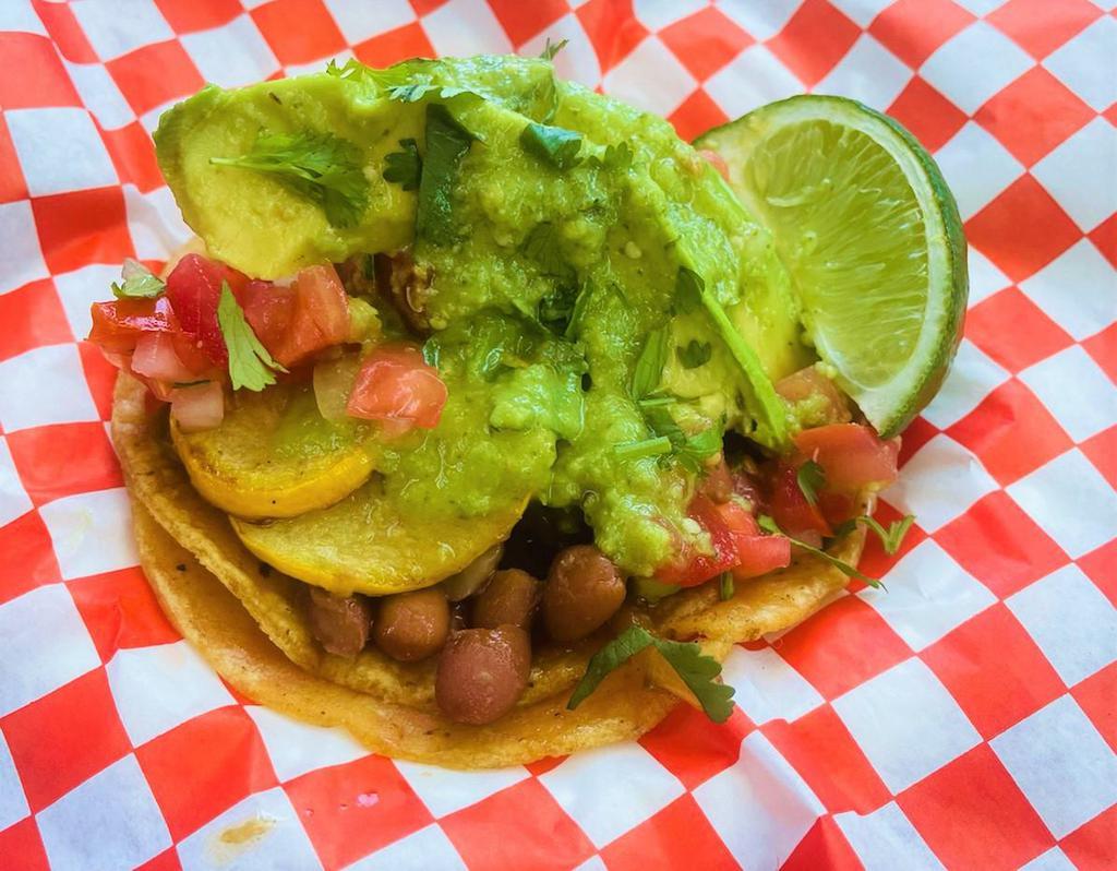Vegetarian Taco · Squash, bell peppers, grilled onions, pinto beans, avocado, and salsa.