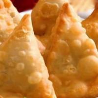 Samosa Classic · Fried pastry with savory-filled spiced potatoes, onions, and peas. Vegetarian, vegan and spi...