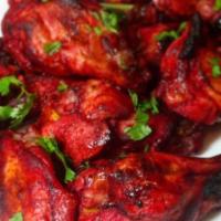 Spicy South Chicken · Chicken marinated in dry roast spices and flavored with tomato ketchup and yogurt accentuate...