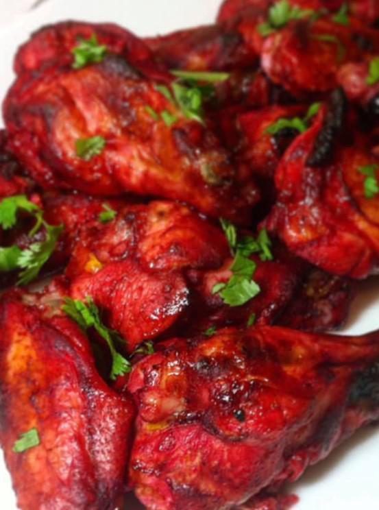 Spicy South Chicken · Chicken marinated in dry roast spices and flavored with tomato ketchup and yogurt accentuates the taste of chicken. Halal.