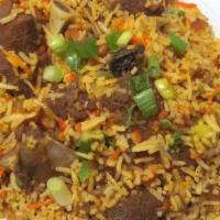 Goat Biryani · Long grained rice flavored with fragrant spices flavored along with saffron and layered with...