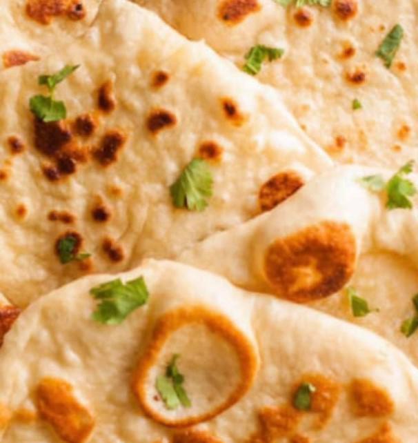 Plain Naan · House-made pulled and leavened dough baked to perfection in an Indian clay oven. Vegetarian.