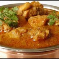 Chicken Curry · Bone-less chicken cooked with Indian spices and sauce.