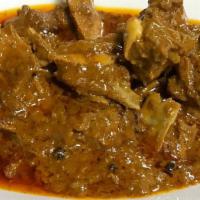 Goat Curry · Bone in goat meat cooked with spices, tomato and onion.