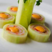 Naruto · Crab stick, flying fish roe, and avocado rolled in thinly sliced cucumber and topped with sp...