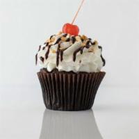 Hot Fudge Sundae · Chocolate cake with our signature buttercream frosting, chopped peanuts, hot fudge, and a ch...