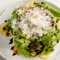 Evita Salad · Butter lettuce, candied walnuts, pickled onions, apple, dates, manchego cheese, balsamic vin...