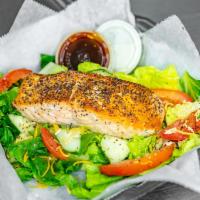 Grilled Salmon Salad · Grilled salmon on a bed of lettuce, tomatoes, cucumbers and cheese.