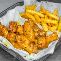 50 Pack Uncle Jeff Honey Jerk Chicken Wings · These wings are tossed with a sweet honey-infused jerk sauce with a mild kick. This package ...