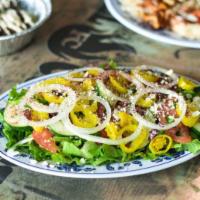 Greek Salad · Green leaf lettuce, Tomatoes, Greek Olives, Banana peppers, olive oil, vinegar, feta cheese,...