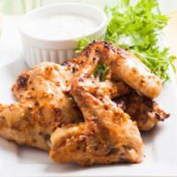 Honey Mustard Fried Chicken Wings · Hand-breaded, golden-fried chicken wings drenched in homemade hor sauce with just the right ...