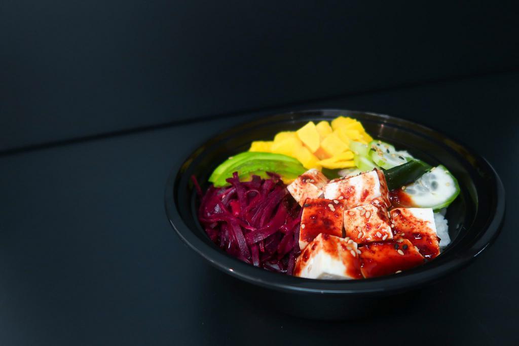 Vegan Donburi · spicy tofu, beet salad, cucumber salad, avocado, mango over rice