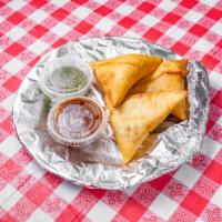 Chicken Samosas · A house specialty. Perfectly fried housemade pastry with spiced chicken. Served with a refre...