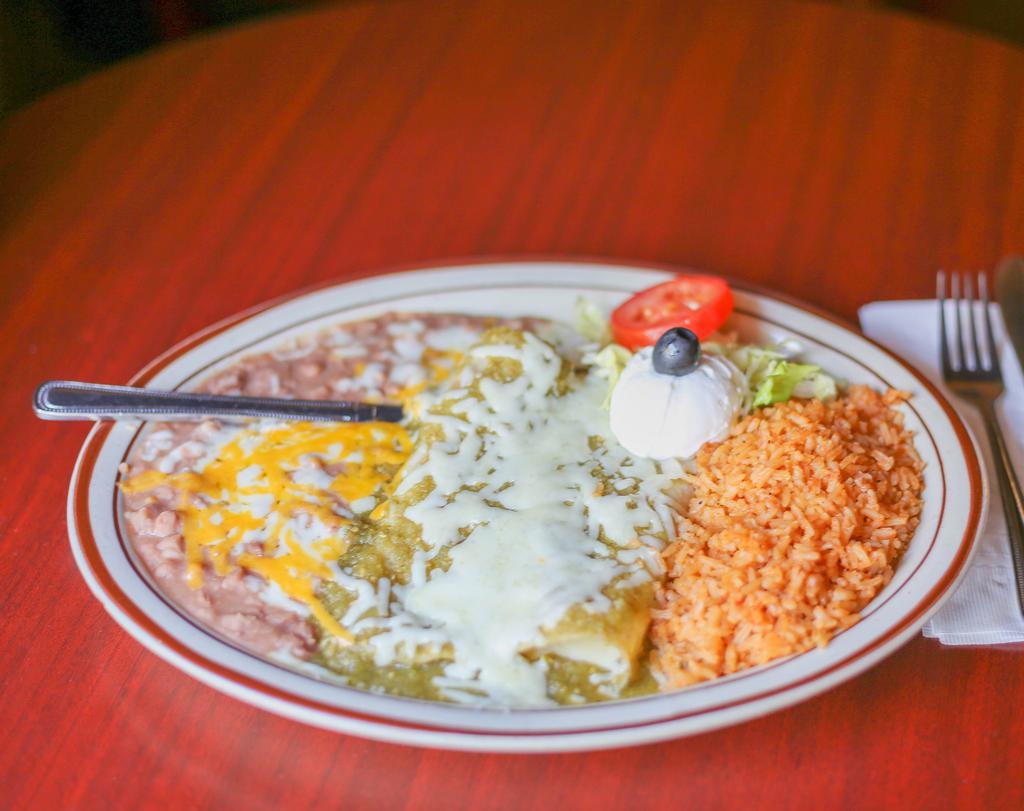 Enchiladas Suizas Dinner · Chicken enchiladas in green sauce, topped with Jack cheese and sour cream.