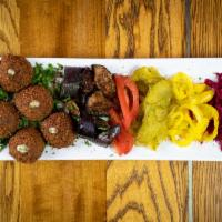Falafel Plate (V) · 6 pieces of chickpeas, parsley, cilantro, onions, garlic made into small balls and served wi...