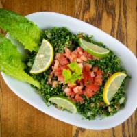 Tabbouli Salad (V)  · Fresh herb salad with parsley, groats, tomato, onion dressed with olive oil and lemon juice.