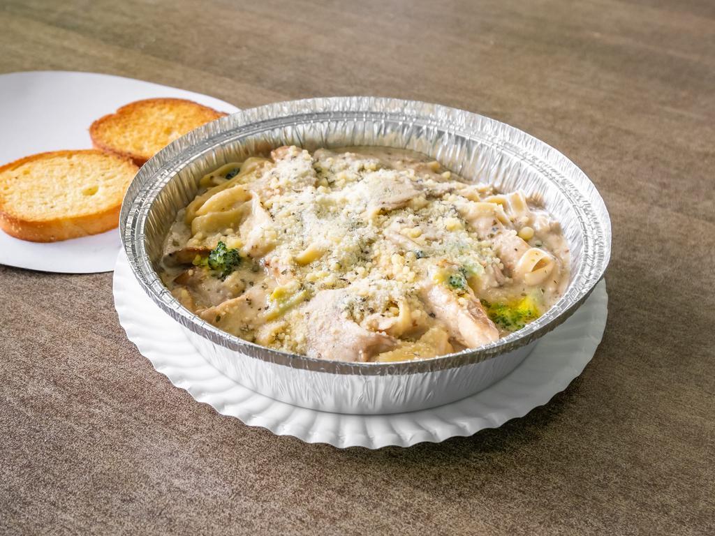Chicken Alfredo · Grilled marinated chicken breast, sauteed Broccoli, and mushrooms and our creamy Alfredo sauce, serve over Fettuccine, and topped shredded parmesan cheese, includes garlic bread