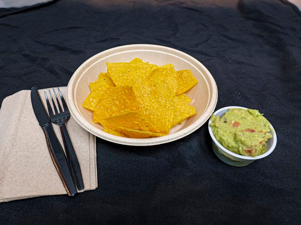 Tortilla Chips and House Made Guacamole · 