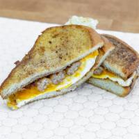 Waffle Breakfast Sandwich · 2 eggs (your choice) with bacon, ham, sausage, or turkey sausage and your choices of cheese. 