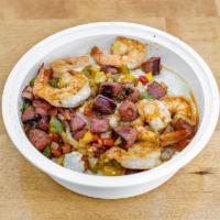 Shrimp and Grits · Flavorful loaded with juicy shrimp and spicy sausage over creamy savory grits.