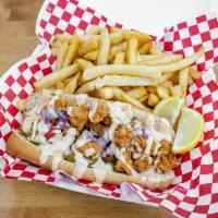 Shrimp Po Boy Sandwich · This Big Easy addition is on a flaky French
bread crust filled crispy shrimp, crunchy
lettuc...