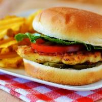 Chicken Breast Sandwich  · With melted Jack cheese. Served with tomato, lettuce, onions, pickles and fries.