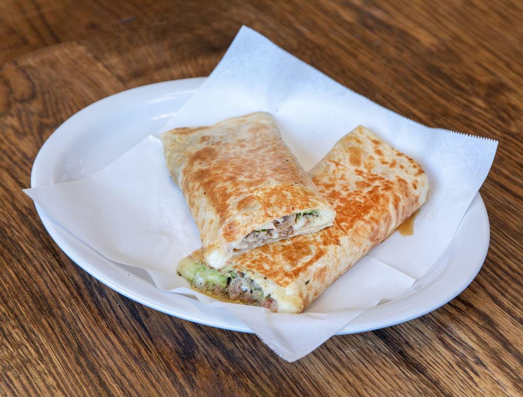 Super Quesadilla · Flour tortilla with choice of meat, guacamole, sour cream, cheese and salsa. 