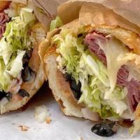 Pastrami and Roast Beef Combo Sandwich · Pastrami, roast beef, lettuce, tomato, pickle, Swiss, Russian.