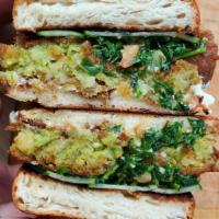 Tabouli Grinder · Housemade falafel, tzatziki, fresh herb tabouli, sliced cucumbers. Vegetarian and vegan sala...