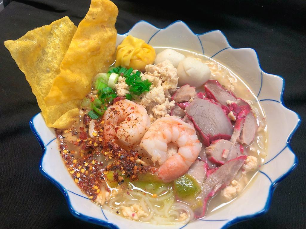 Pao Pak Tom Yum Noodle · Sour, sweet and spicy of hot boiling small rice noodle soup shrimp, ground chicken, bbq pork,fish ball  and fried wonton. Top with fresh roasted peanut and green onion.k