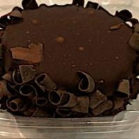 Chocolate Cake  · Chocolate cake topped with chocolate frosting and dark chocolate shavings.   (Single serve)