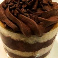 Chocolate Mousse Cake  · Layers of moist vanilla cake sandwiched with creamy chocolate mousse and finished with dark ...