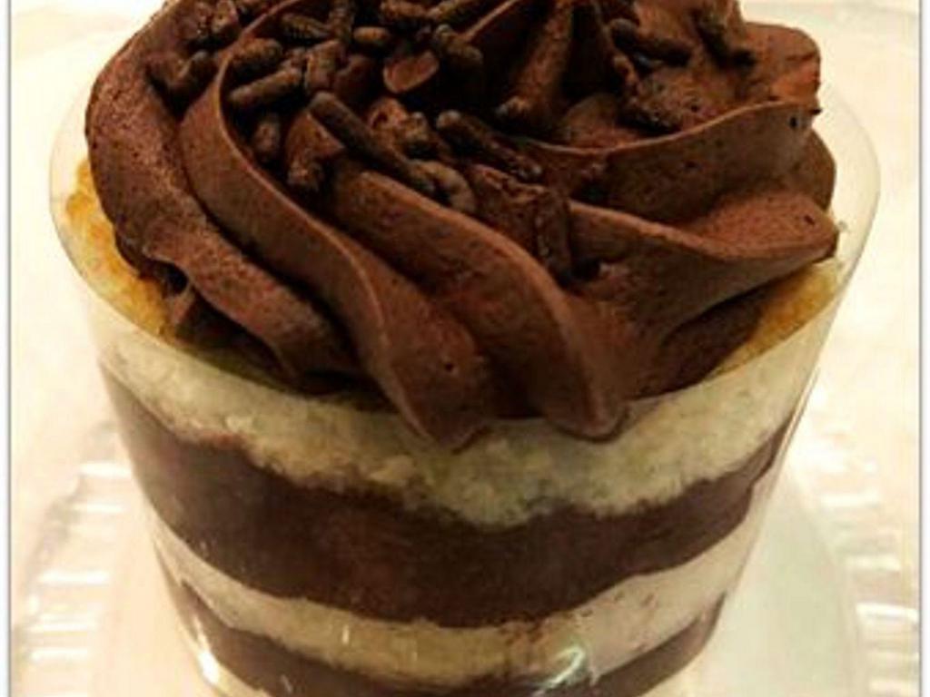 Chocolate Mousse Cake  · Layers of moist vanilla cake sandwiched with creamy chocolate mousse and finished with dark chocolate shavings. (Single serve)