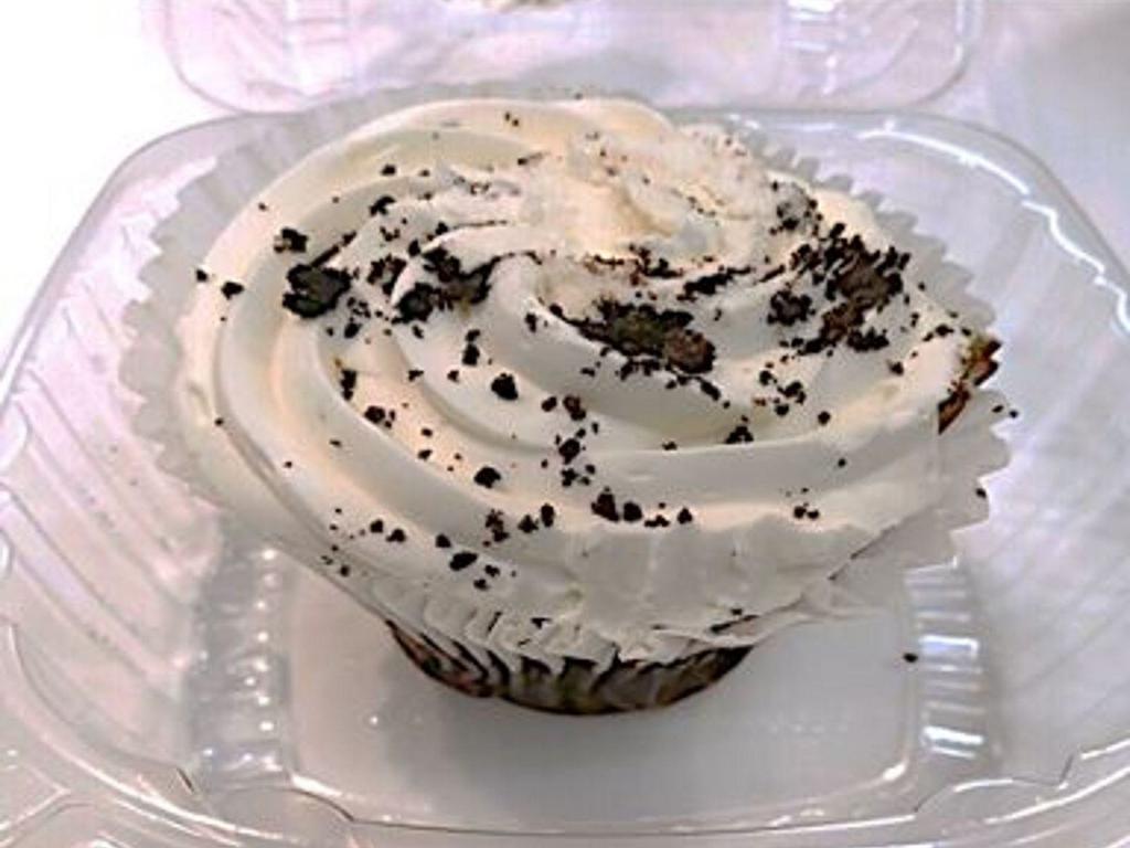 OREO® Cookie Cupcake · A rich chocolate cupcake topped with vanilla cream and real OREO® cookie bits.