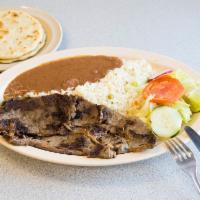 Carne Asada · Charbroiled steak. Served with rice, beans and salad.