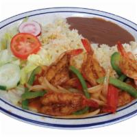 Camarones Rancheros · Ranch style shrimps. Served with rice, beans and salad.