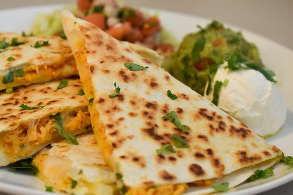 Quesadillas · Grilled flour tortillas with mozzarella cheese and your choice of meat. Side of iceberg lettuce, pico de gallo, sour cream and guacamole.