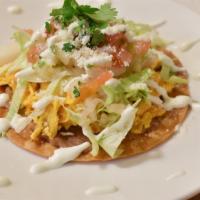 Tostadas · Crispy tortilla with spread of beans. Your choice of meat topped with lettuce, pico de gallo...